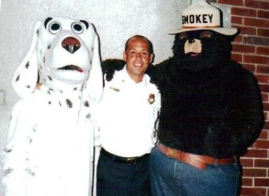 Assistant Chief Jason Simmons with friends at an Open House. 